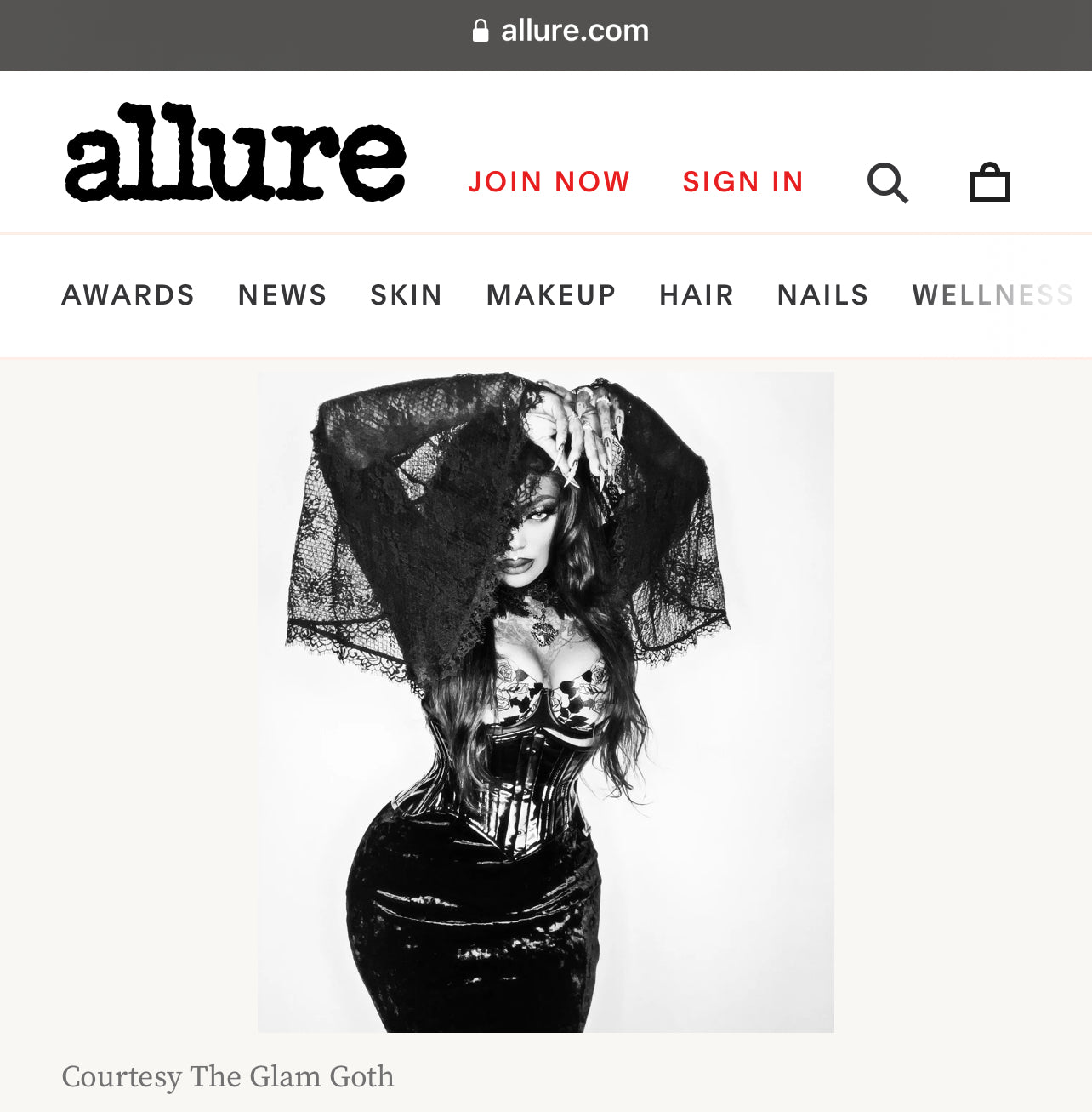 Allure magazine website with a black and white image of a marley bloodrose wearing a sheer veil.